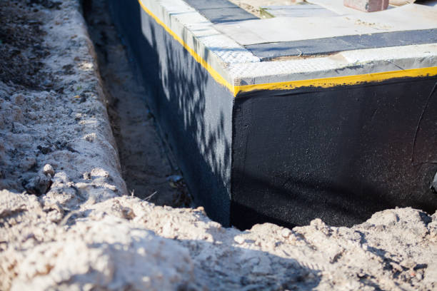 Professional Basement Waterproofing technician working in Cordova, NC